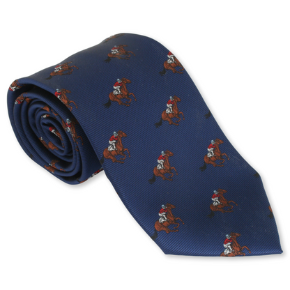 A rolled-up blue necktie with a pattern of horse and jockey figures in a racing context.